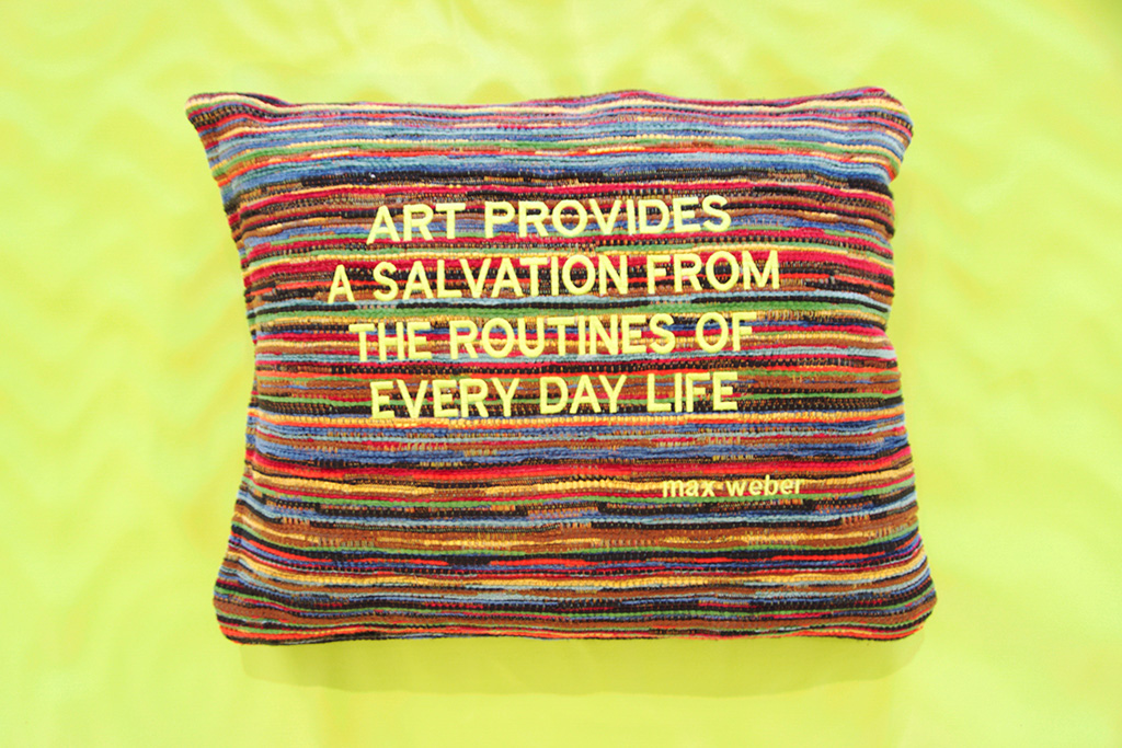 A quote stitched on a pillow